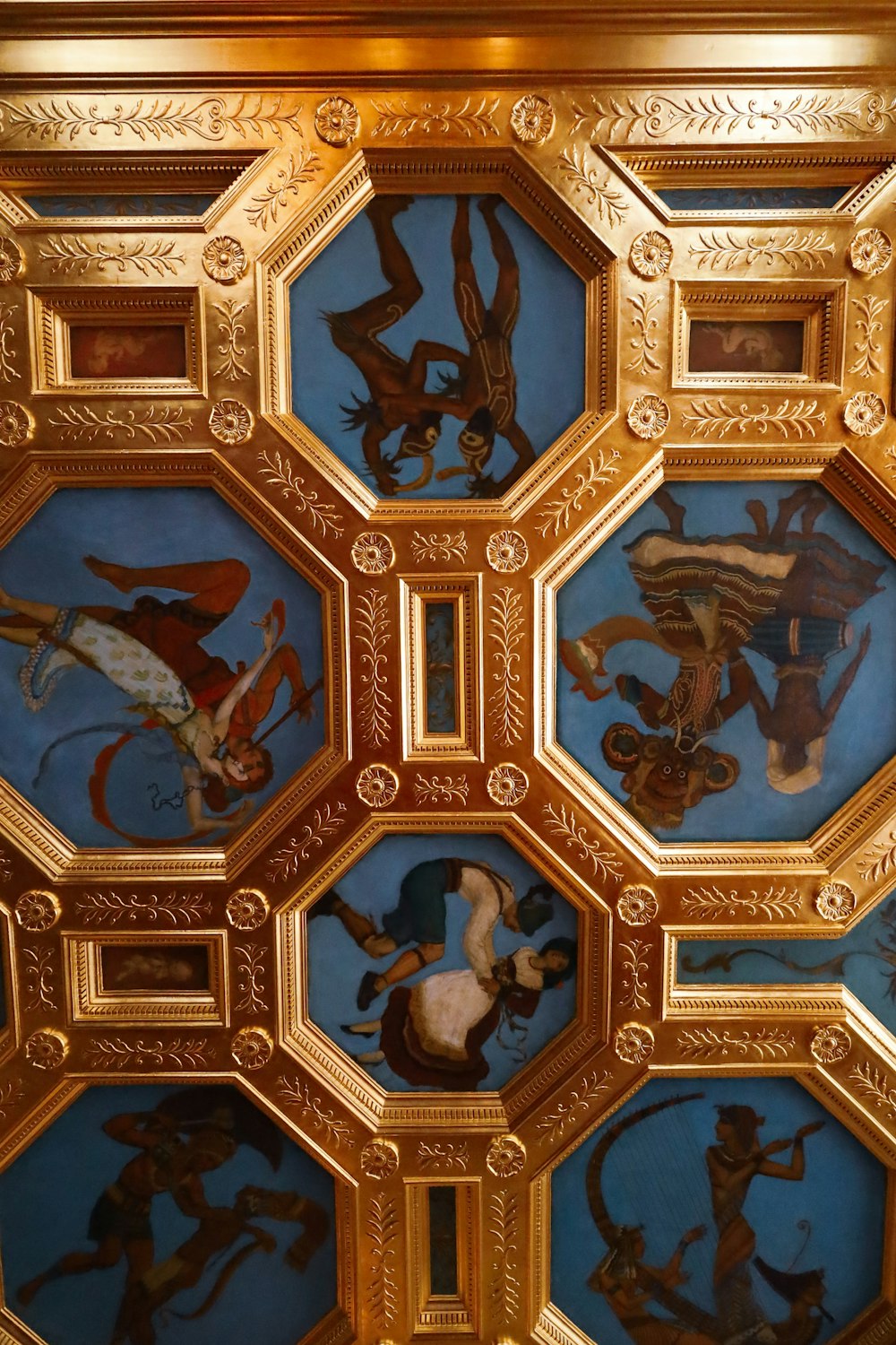 a ceiling with a bunch of paintings on it