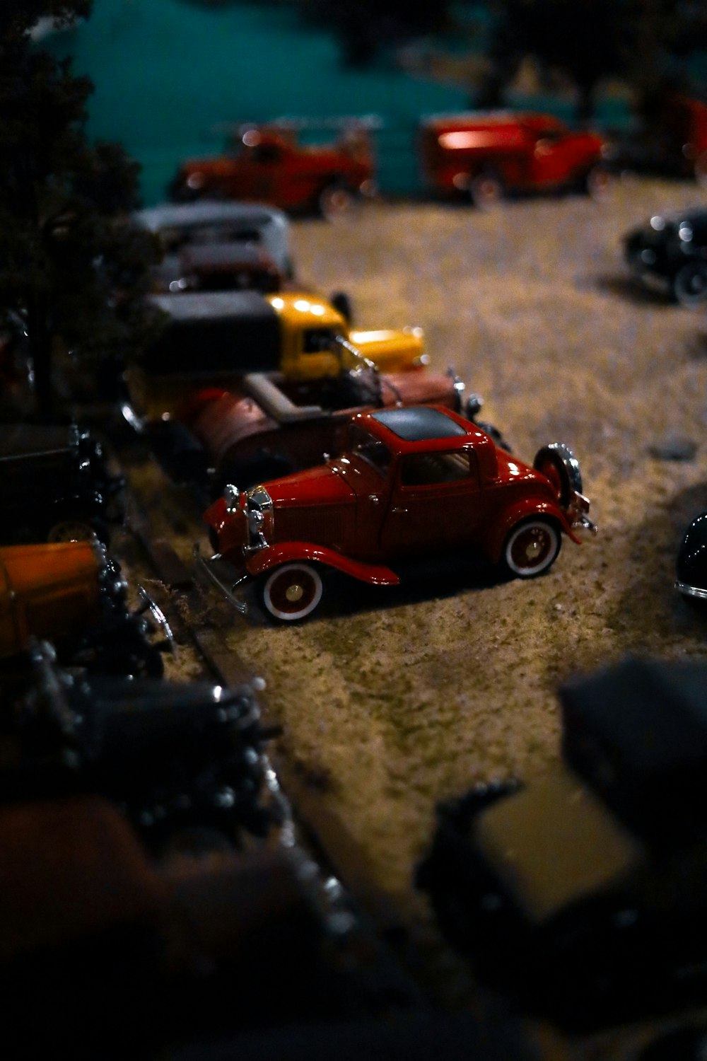 a group of toy cars sitting in a parking lot