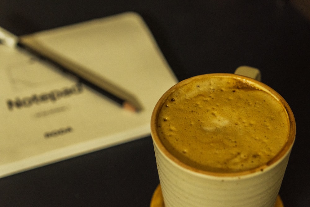 a close up of a cup of coffee on a table