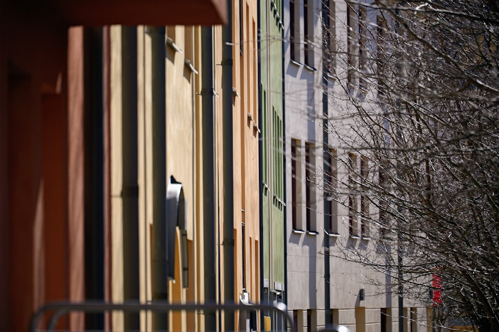 a row of multicolored buildings next to each other