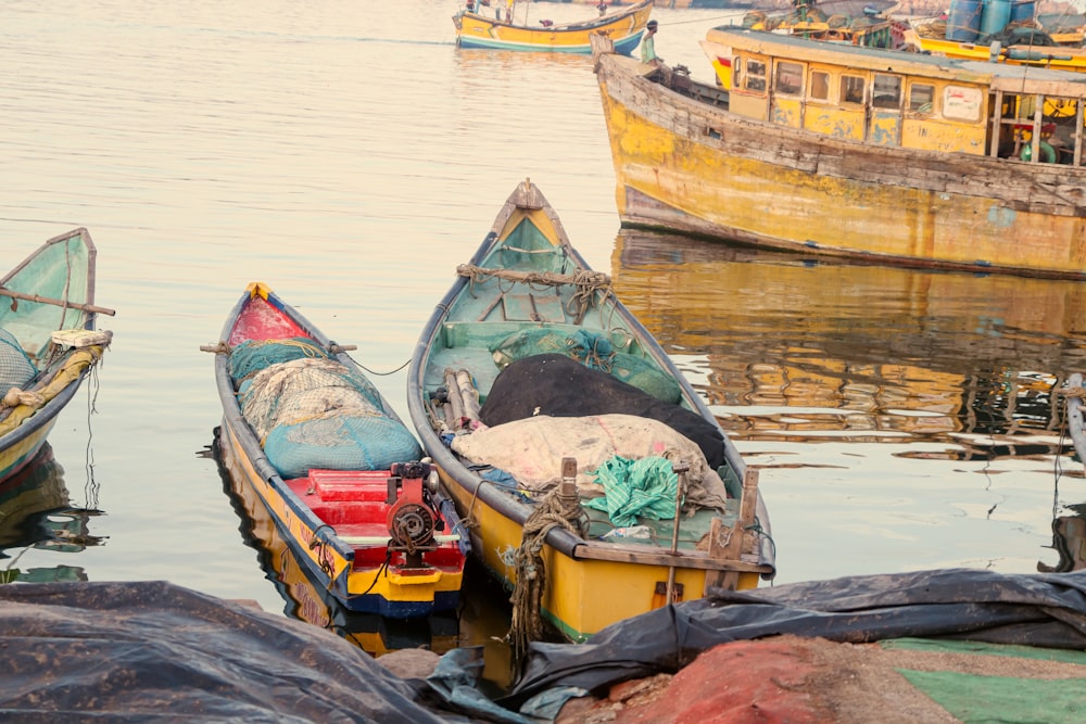 a group of boats floating on top of a body of water