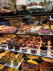 a display case filled with lots of cakes and pies