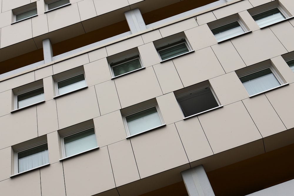 a very tall building with many windows and a clock