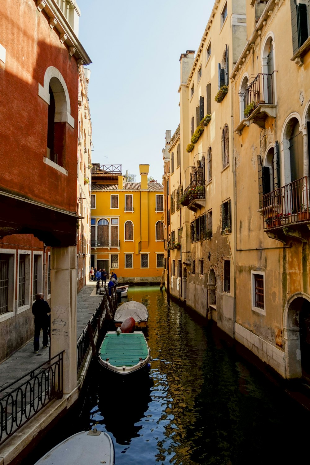 a canal with several small boats in it