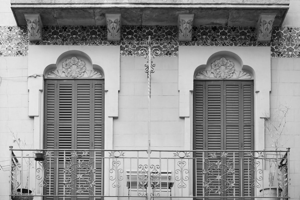 a black and white photo of a balcony