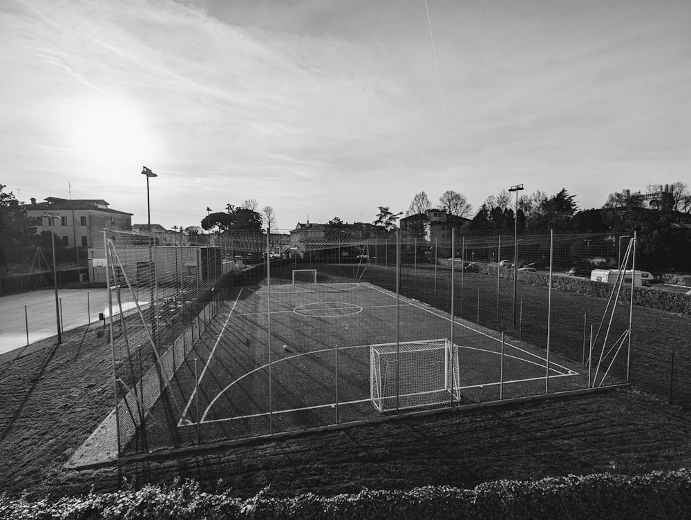 a black and white photo of a soccer field