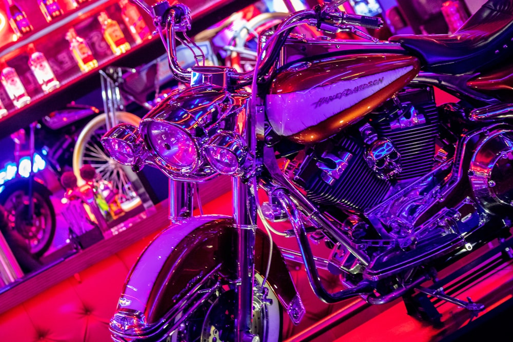 a purple motorcycle parked in front of a bar