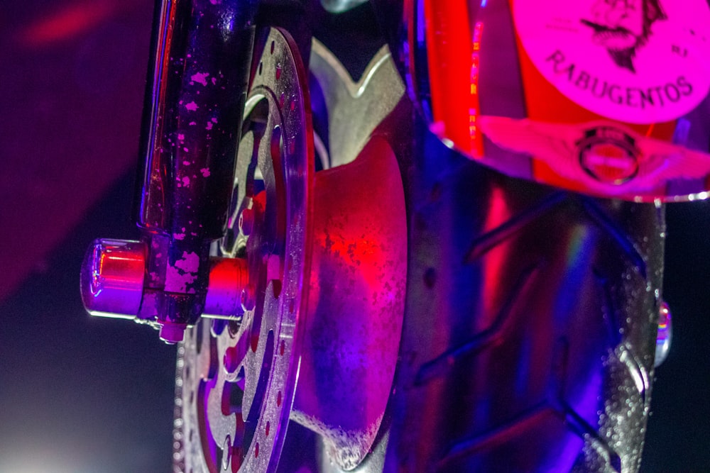 a close up of a bike tire with a clock on it