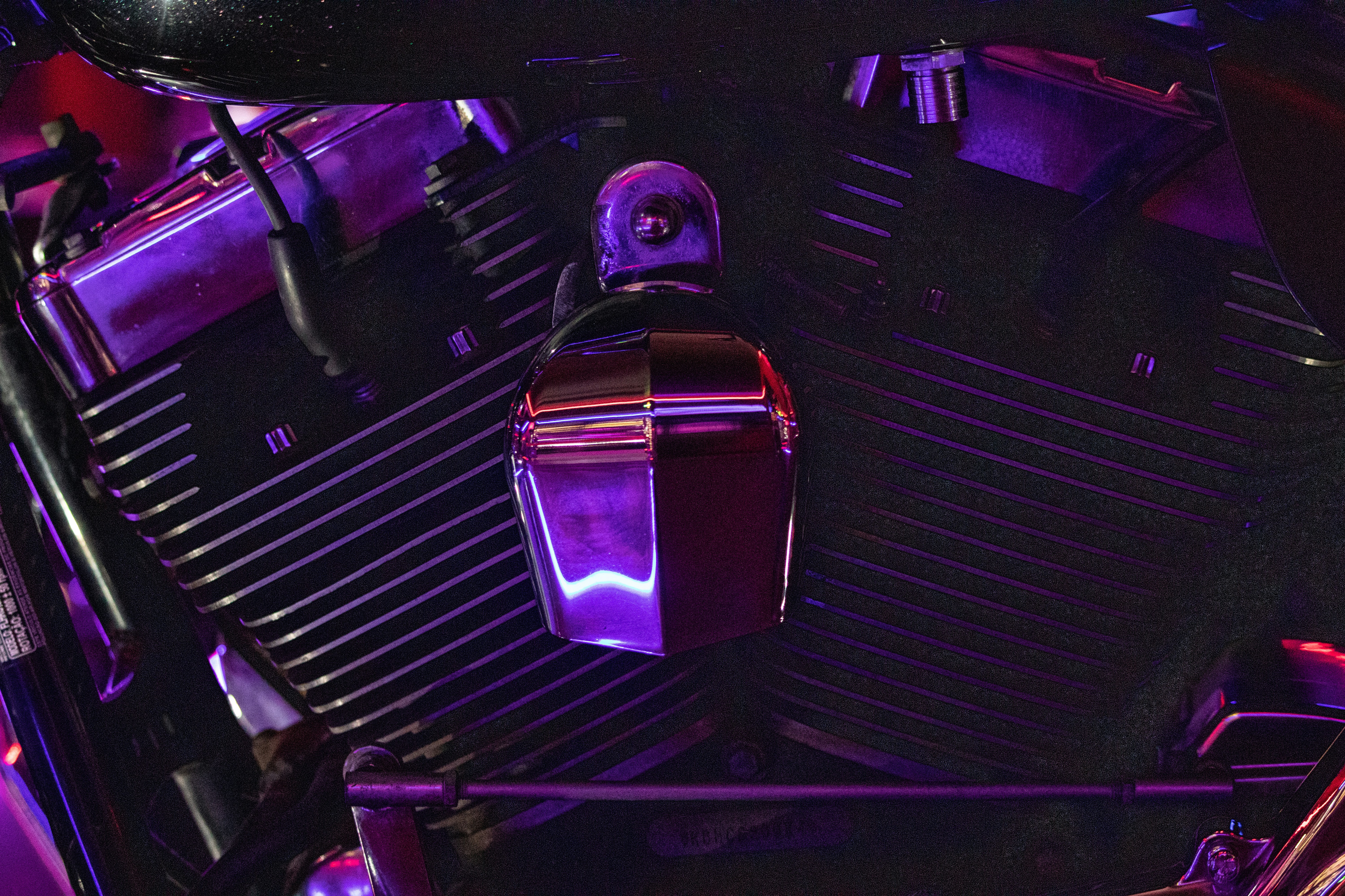 a close up of a purple motorcycle engine