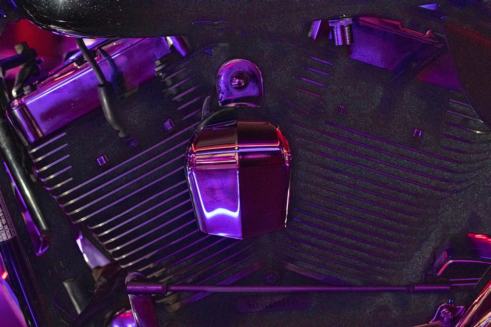 a close up of a purple motorcycle engine