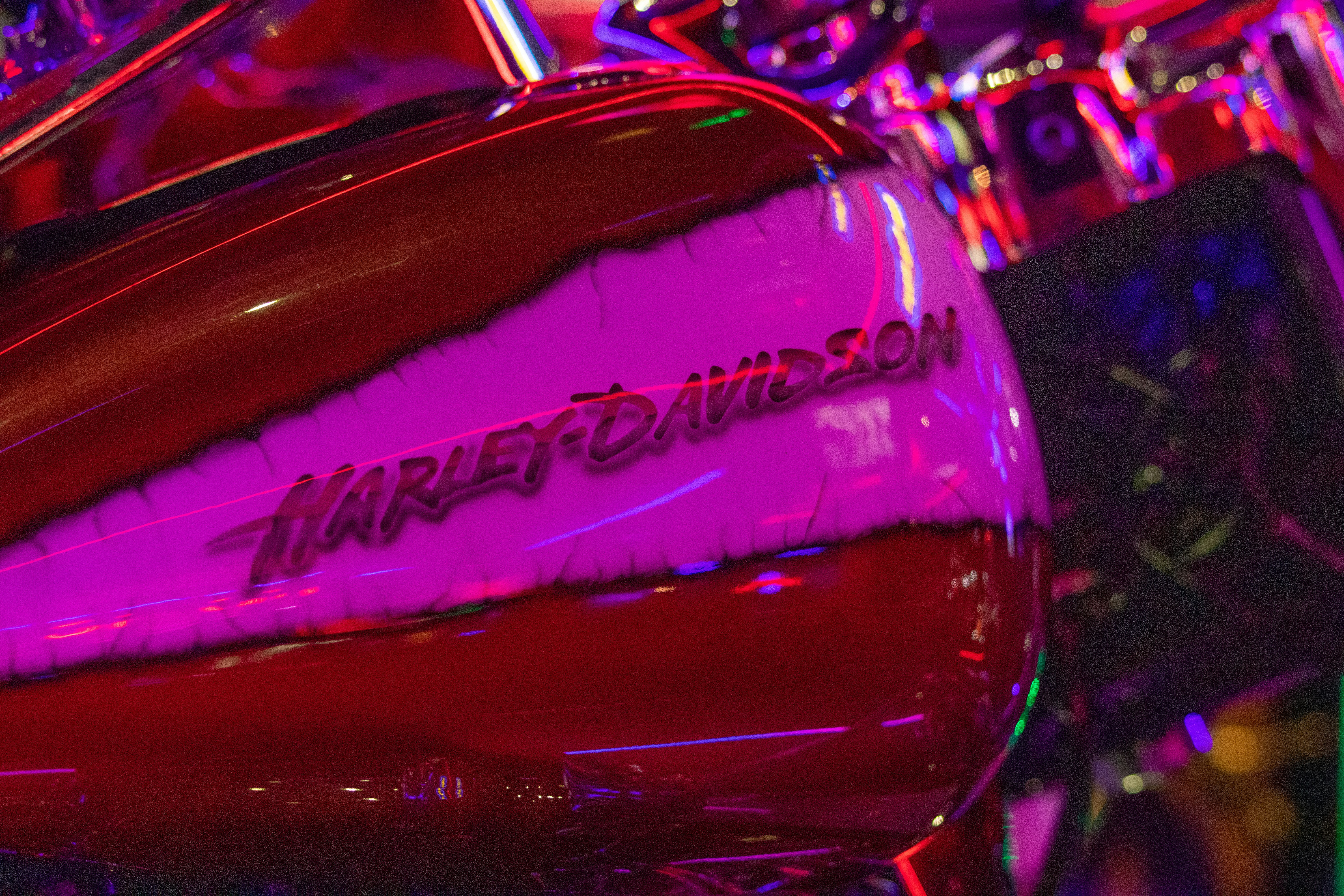 a close up of a red and purple motorcycle