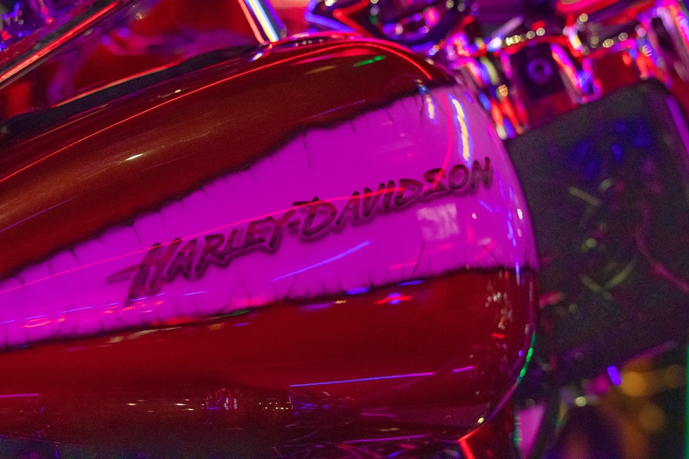 a close up of a red and purple motorcycle