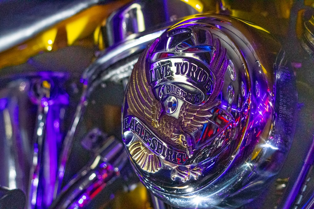 a close up of a motorcycle with a purple light