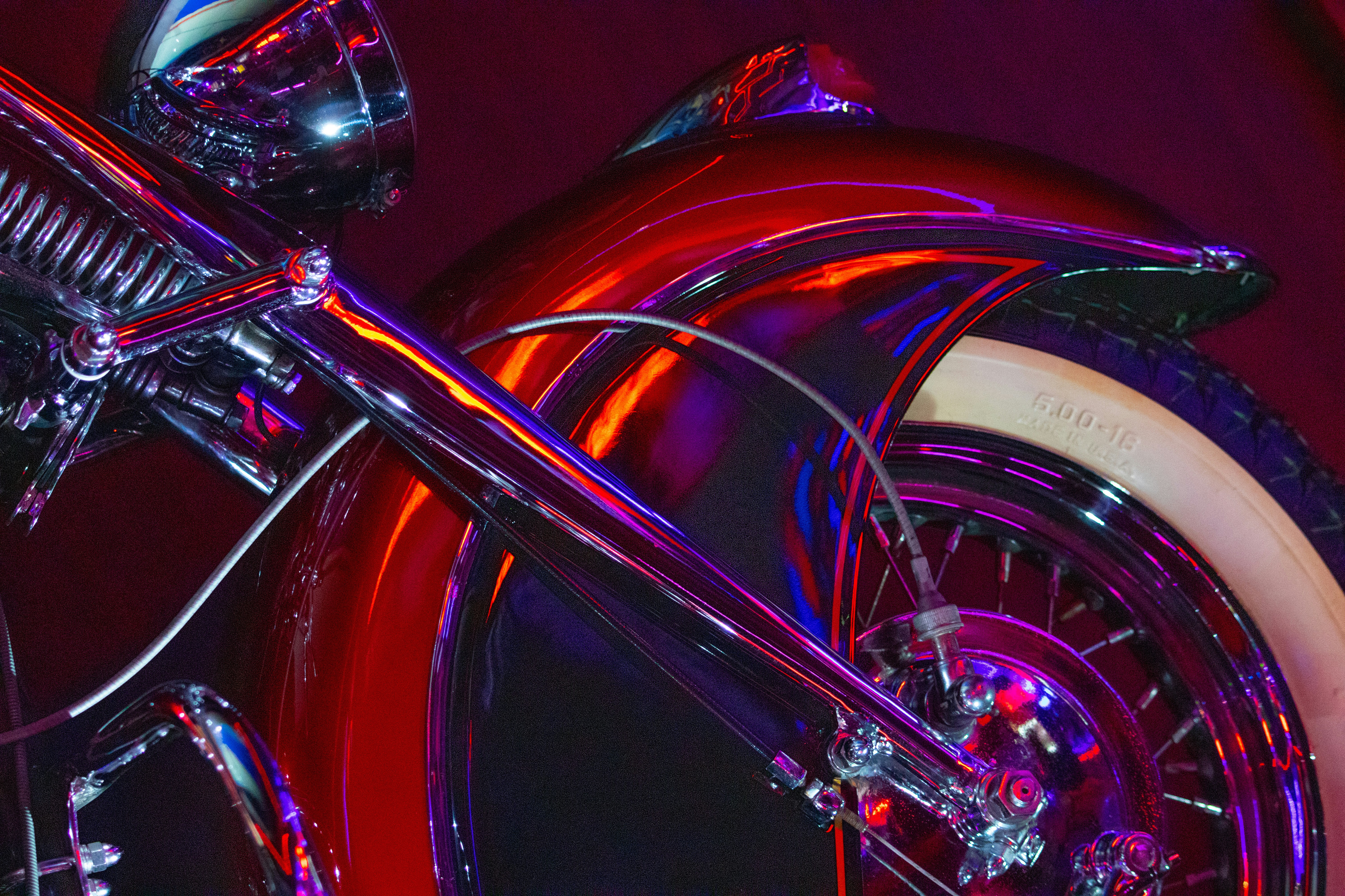 a close up of a motorcycle with a red light