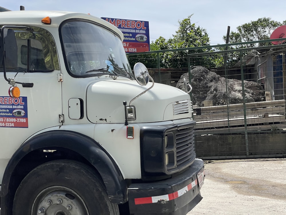 a large white truck parked in a parking lot