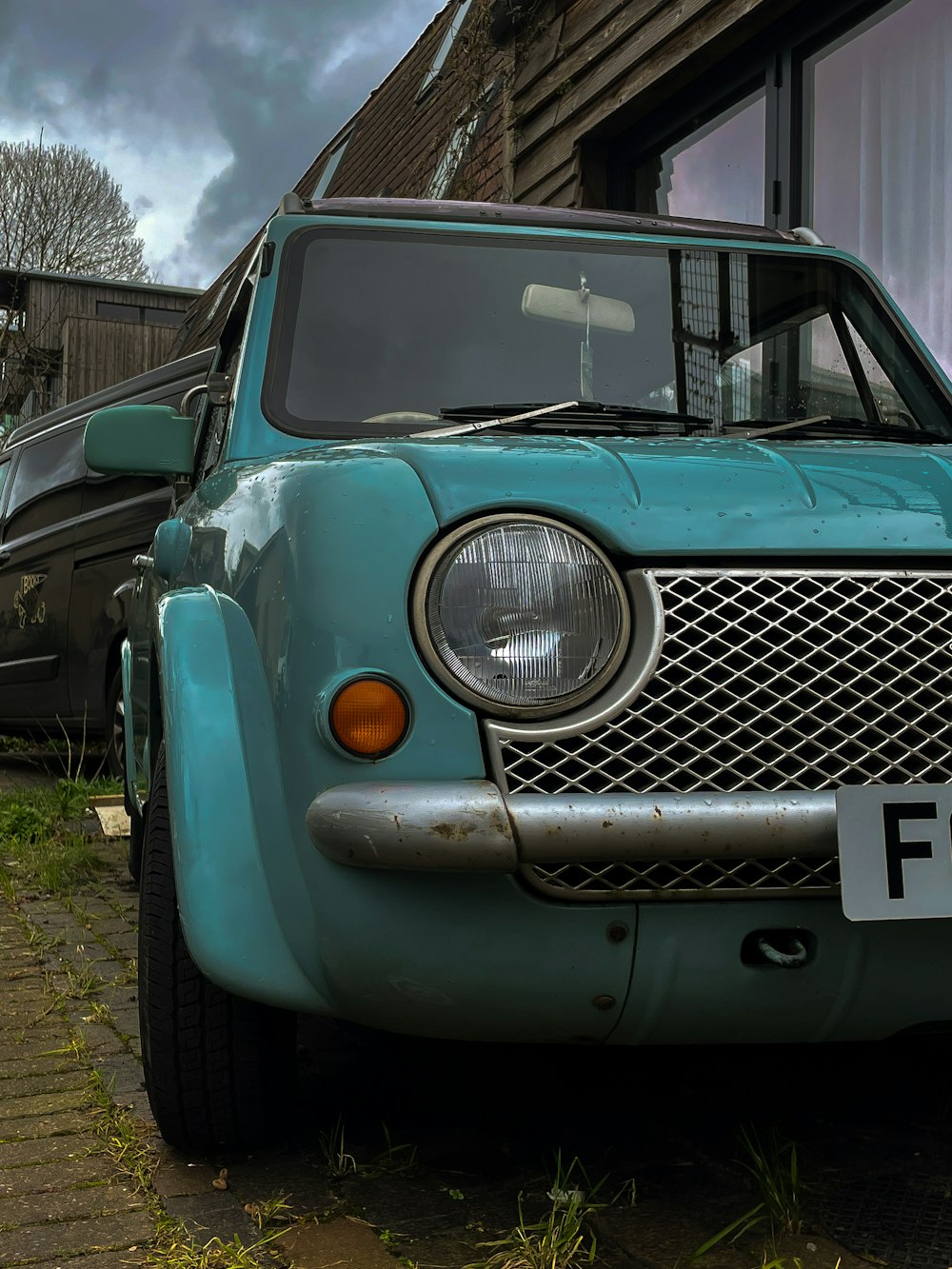 a blue truck parked in front of a building