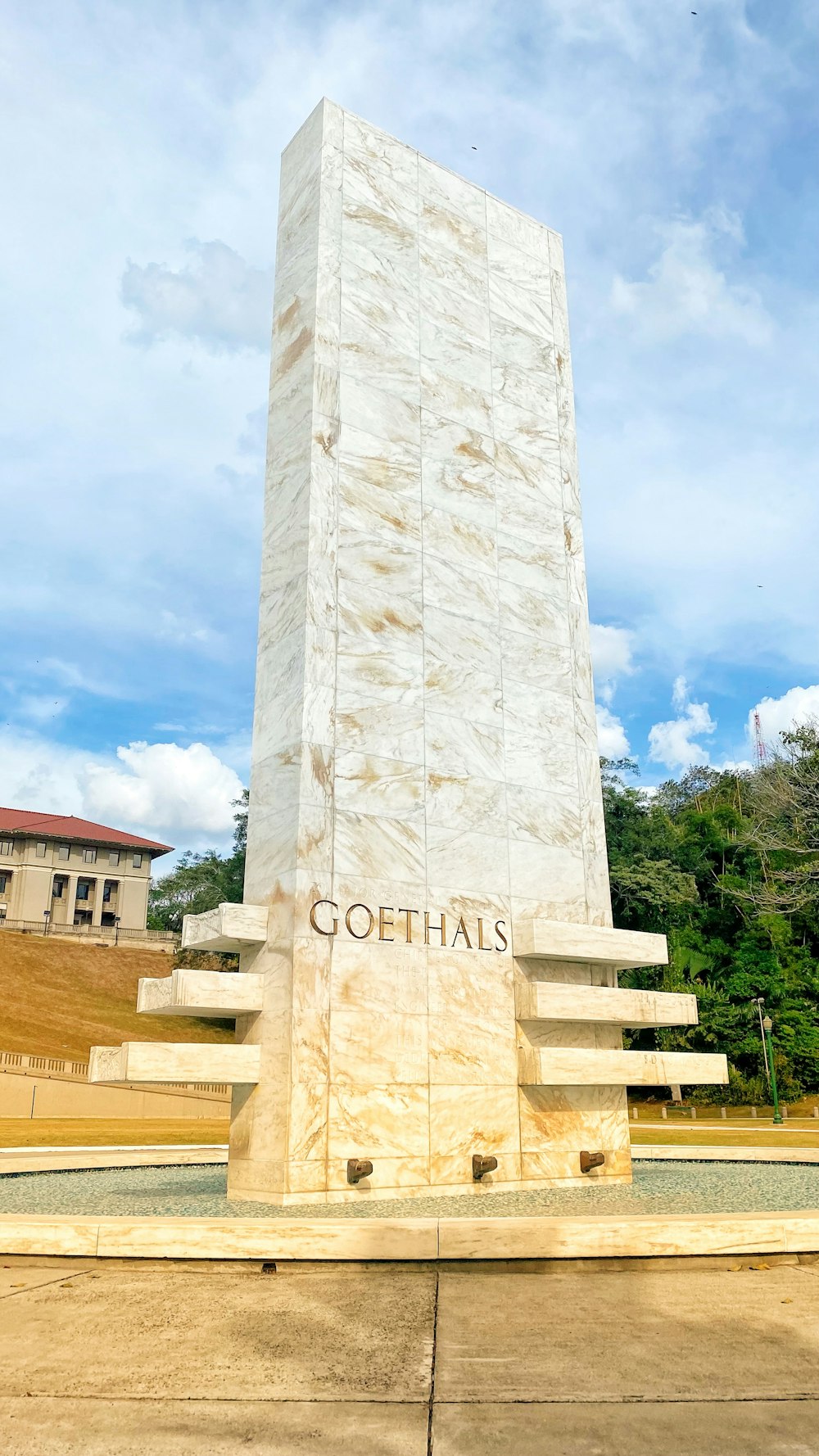 a large white monument with stairs leading up to it