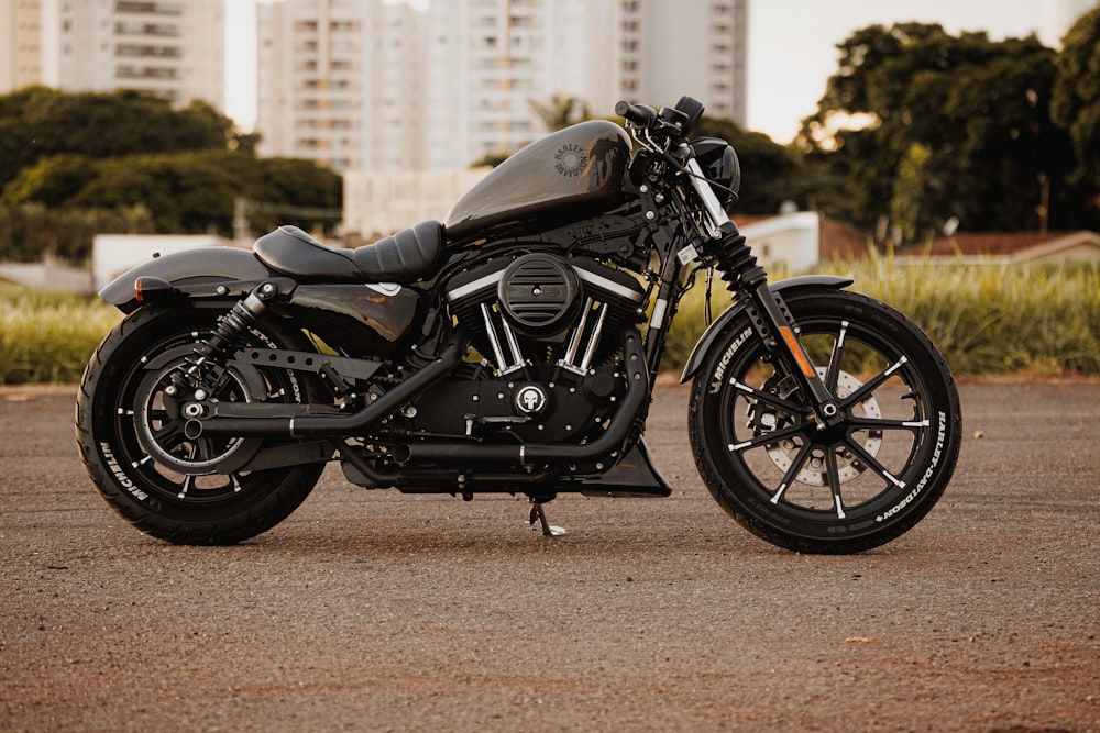 a black motorcycle parked in a parking lot