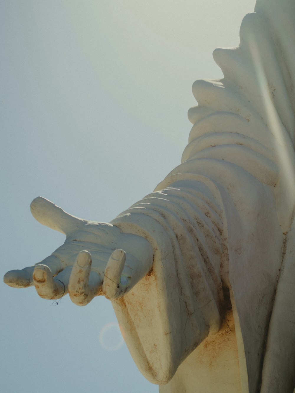 a close up of a statue with a sky background