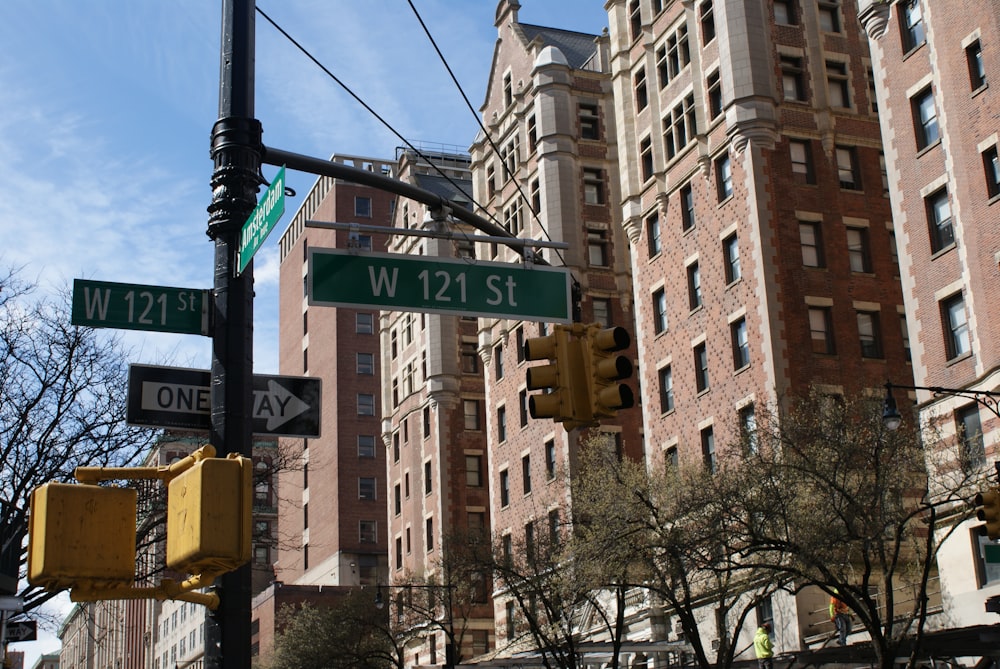 a traffic light and street signs in a city