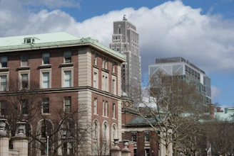 a large building with a clock tower in the background