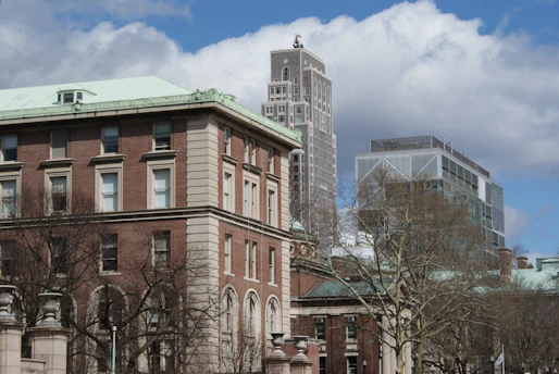 a large building with a clock tower in the background