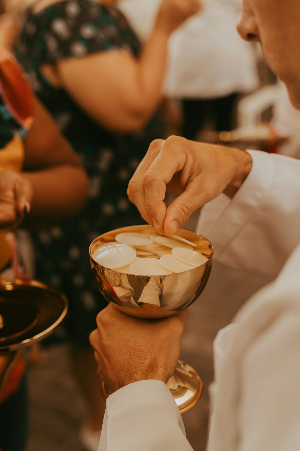 a close up of a person holding a bowl of food