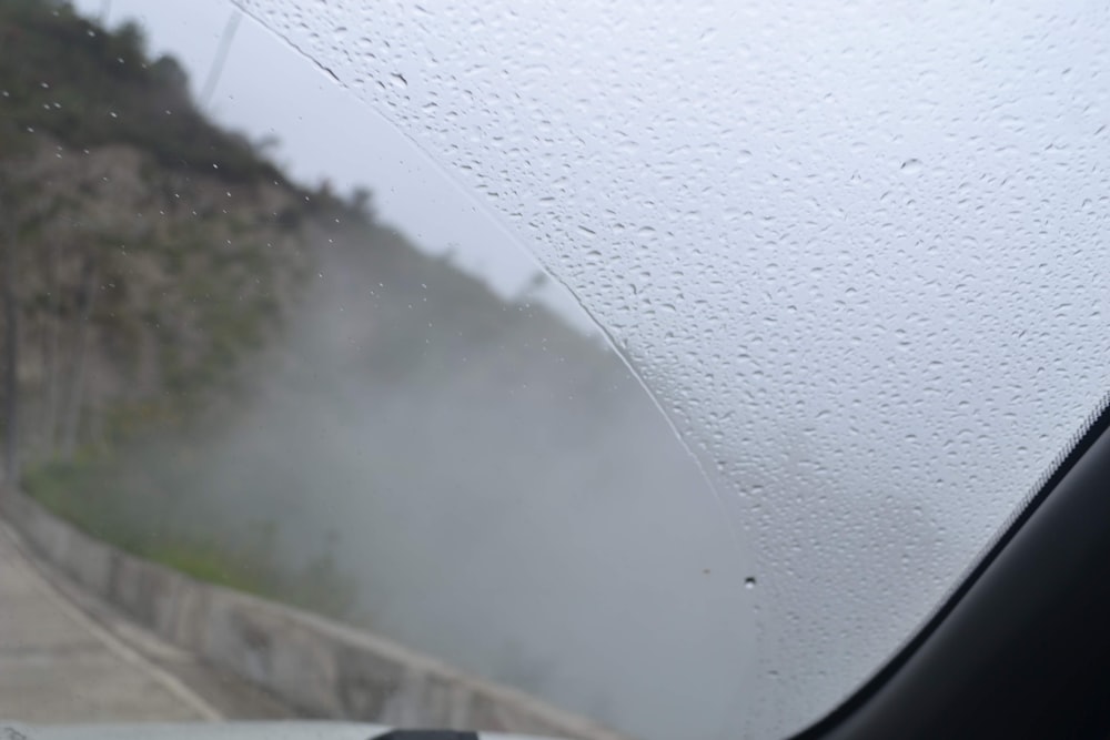 a view of a road from inside a car