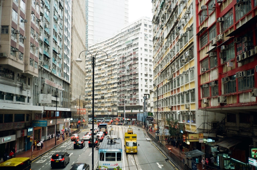 a city street filled with lots of tall buildings