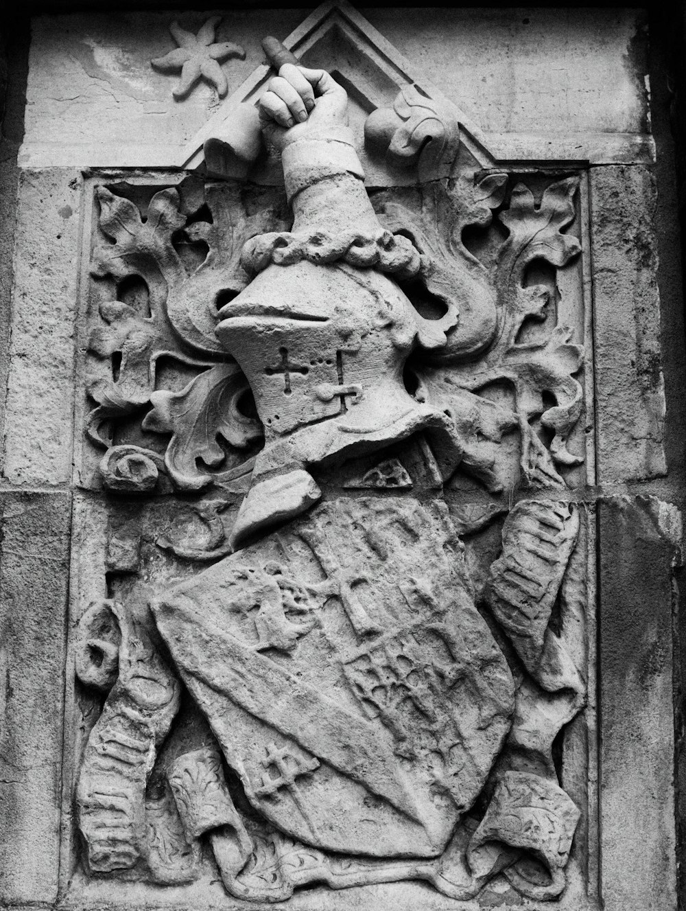 a black and white photo of a coat of arms