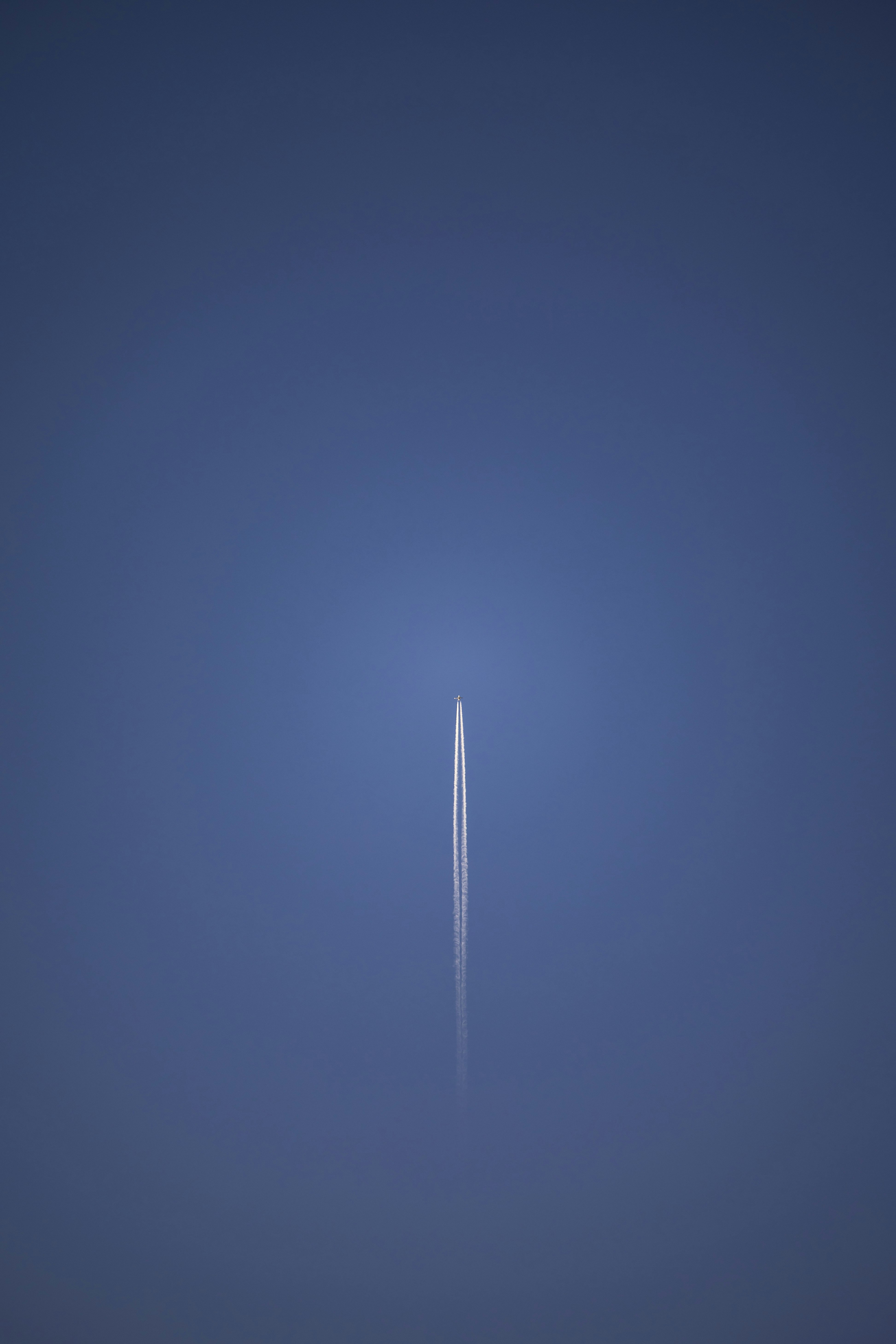 an airplane is flying in the sky at night