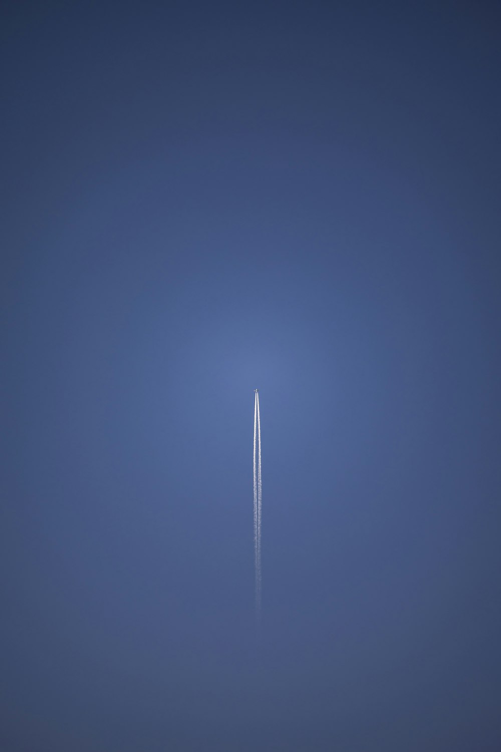 an airplane is flying in the sky at night