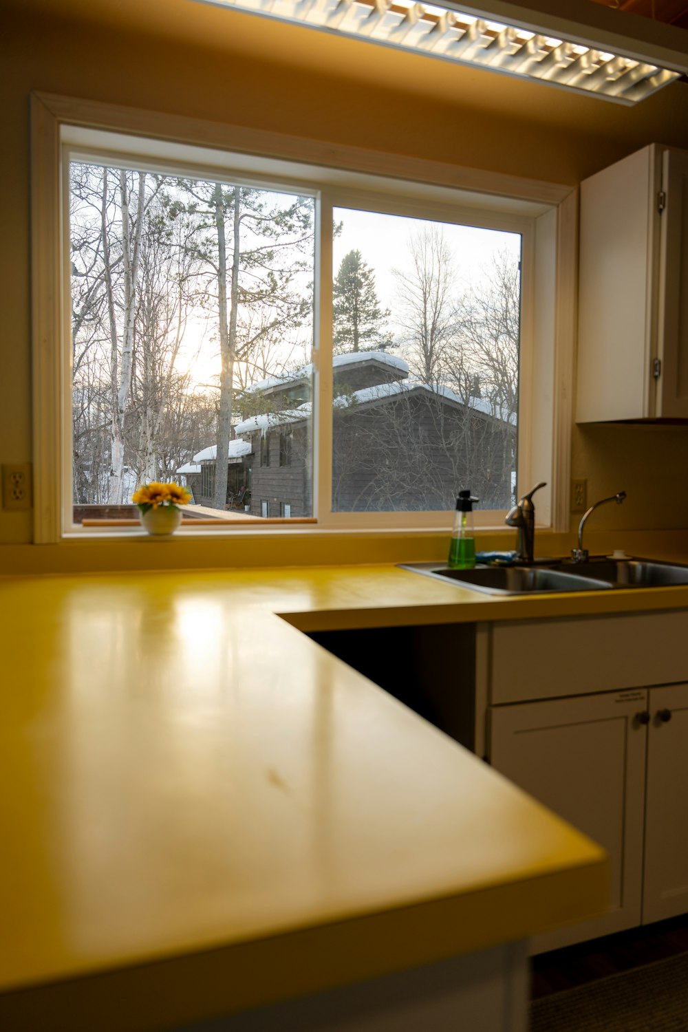 a kitchen with a sink and a window