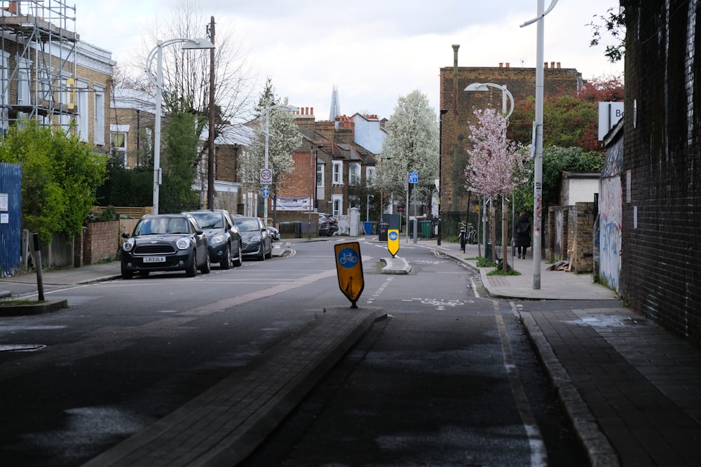 a street with cars parked on the side of it