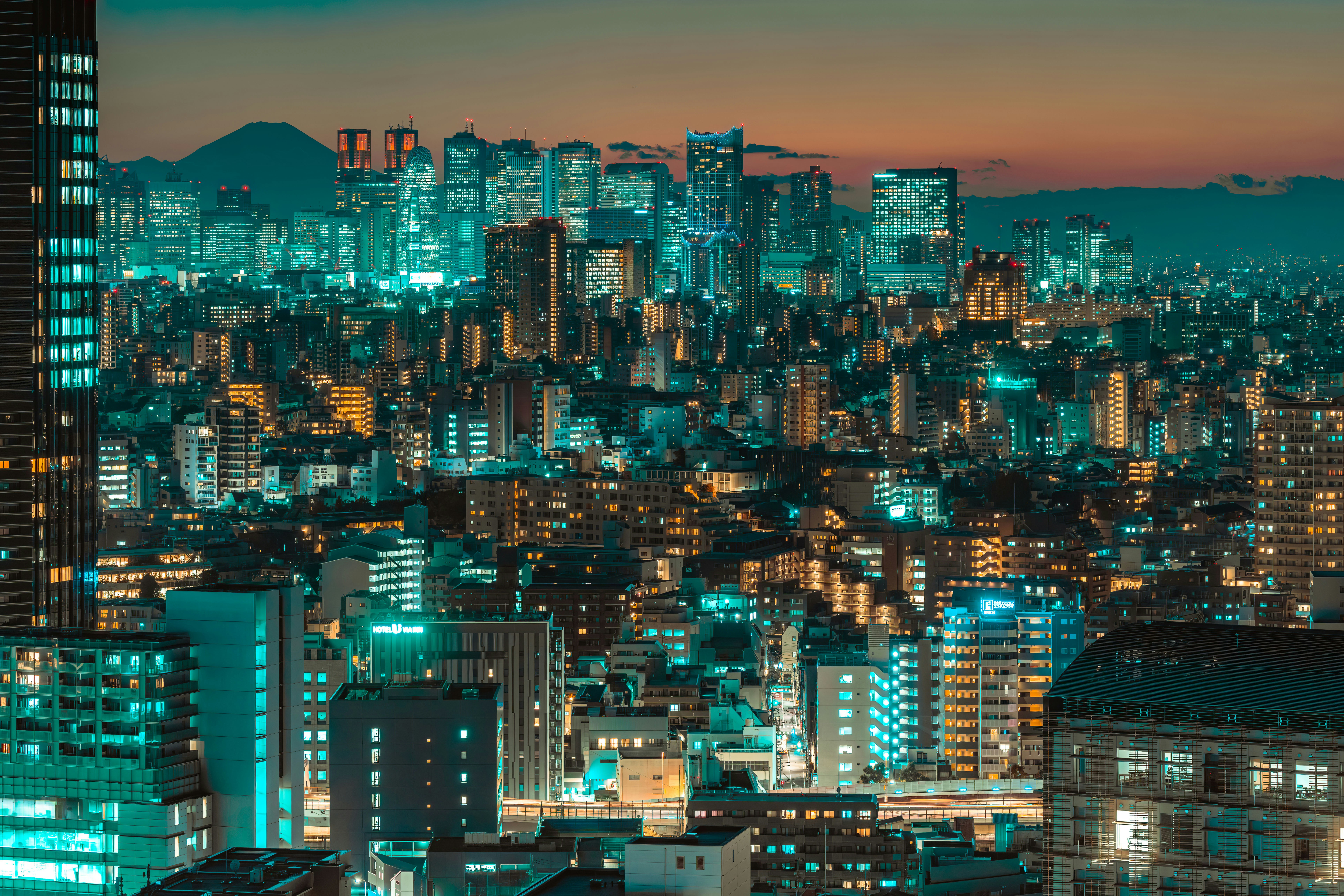 a view of a city at night from the top of a building, 