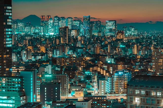 a view of a city at night from the top of a building