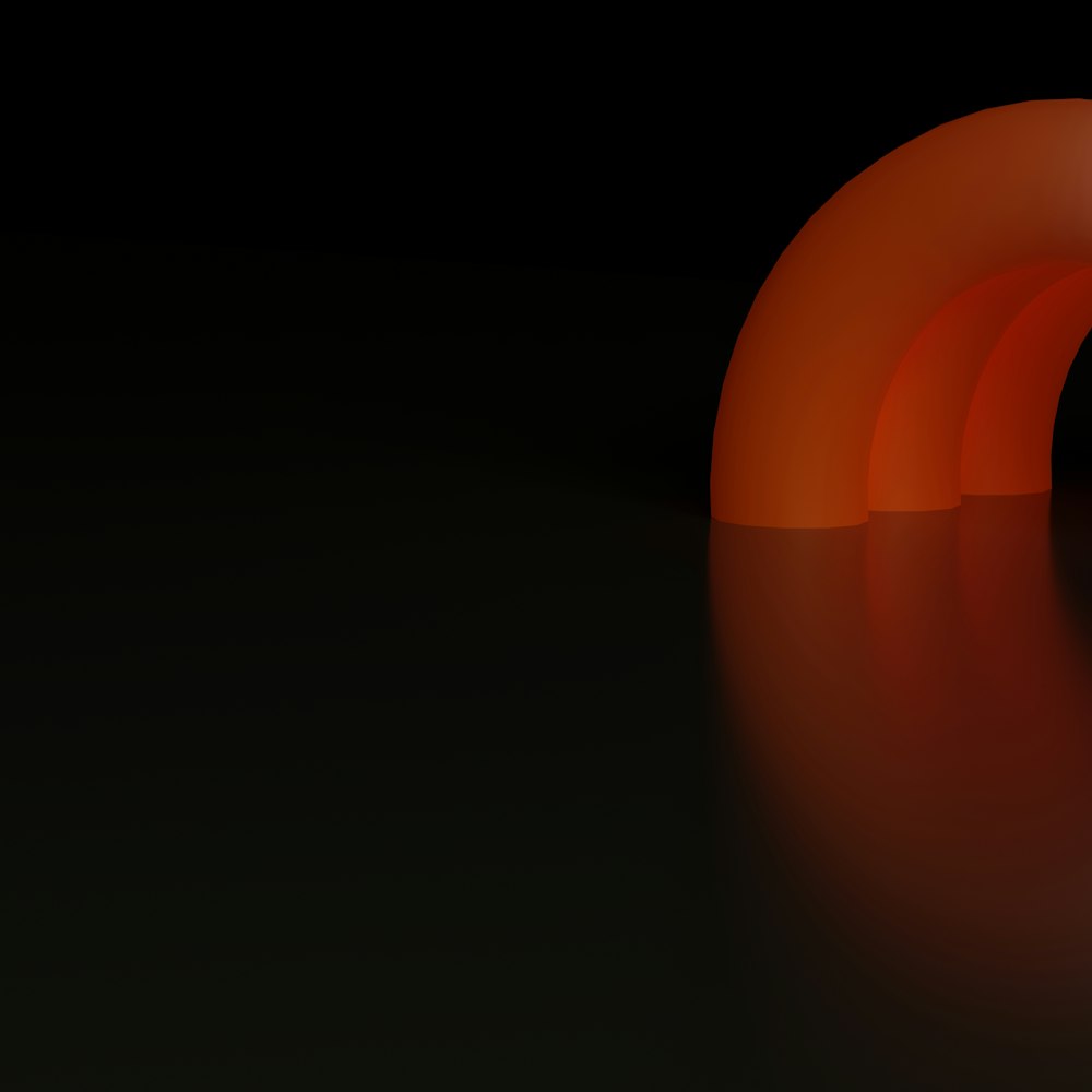 an orange object is shown in the dark