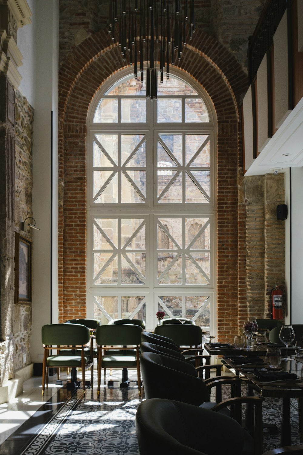 a large arched window in a brick building