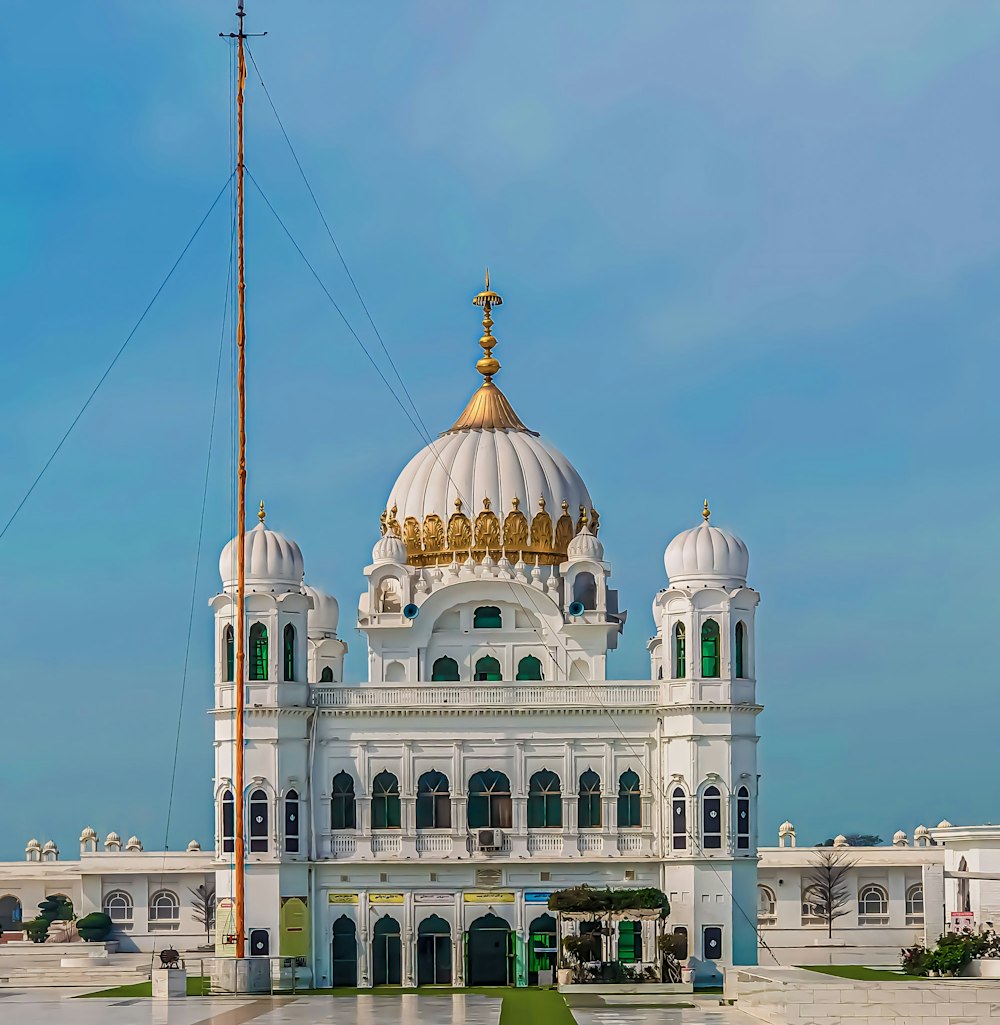 a large white building with a golden dome