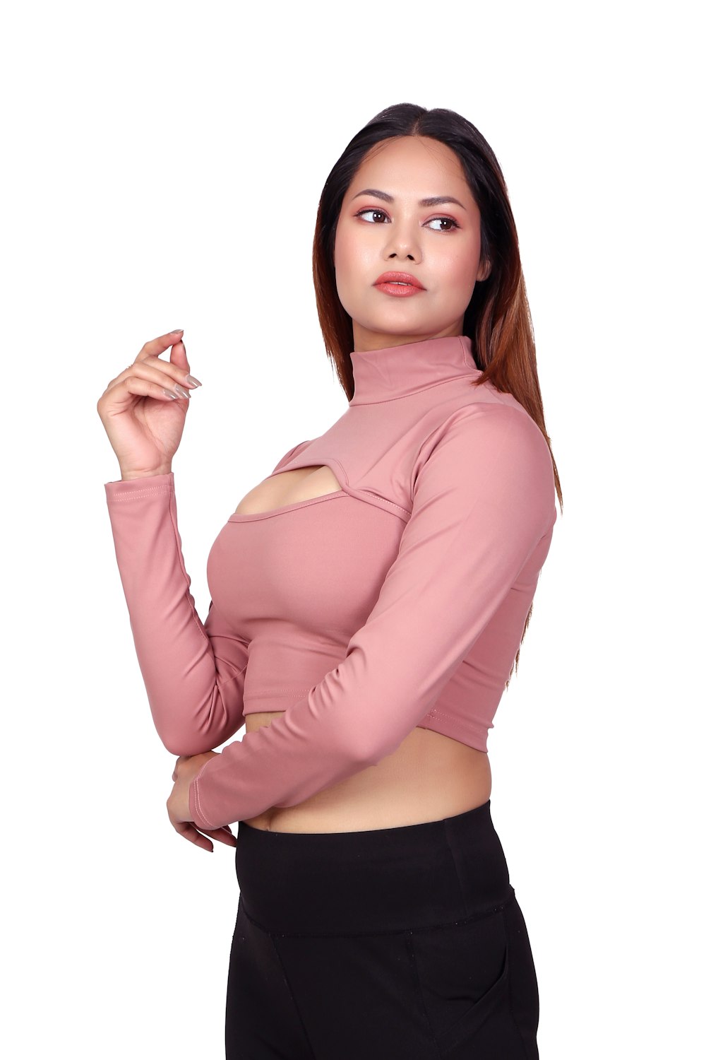 a woman in a pink top smoking a cigarette