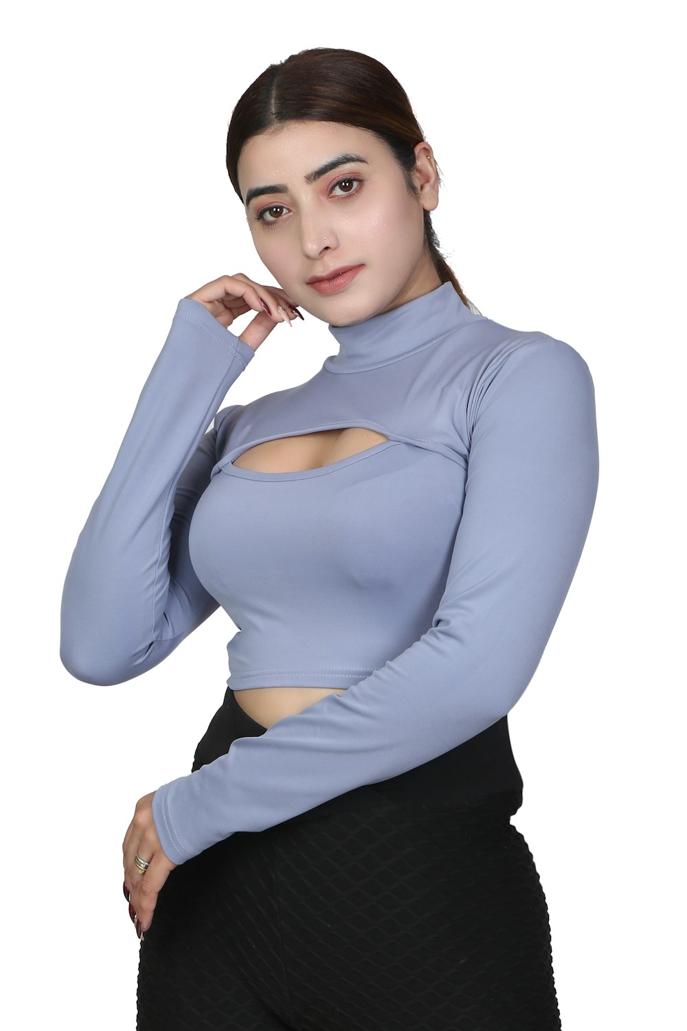 a woman in a blue top posing for a picture