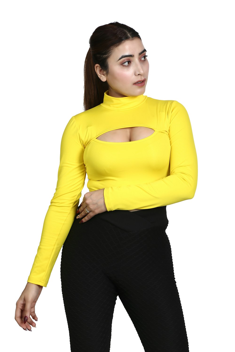 a woman wearing a yellow top and black pants