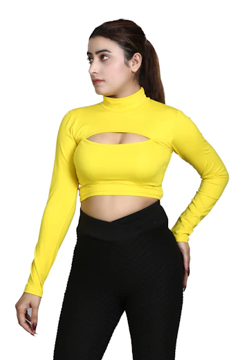 a woman wearing a yellow top and black pants