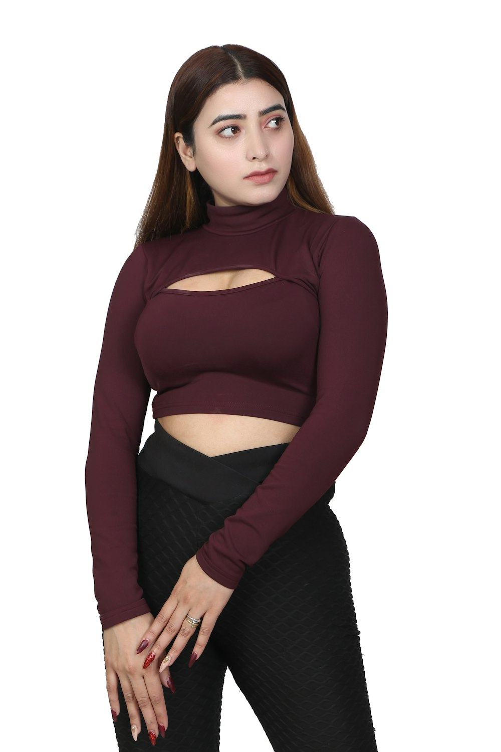 a woman in a maroon top and black pants