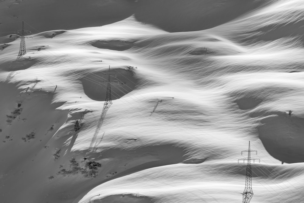 a snow covered mountain with a radio tower in the distance