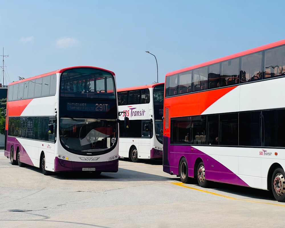 a couple of double decker buses parked next to each other