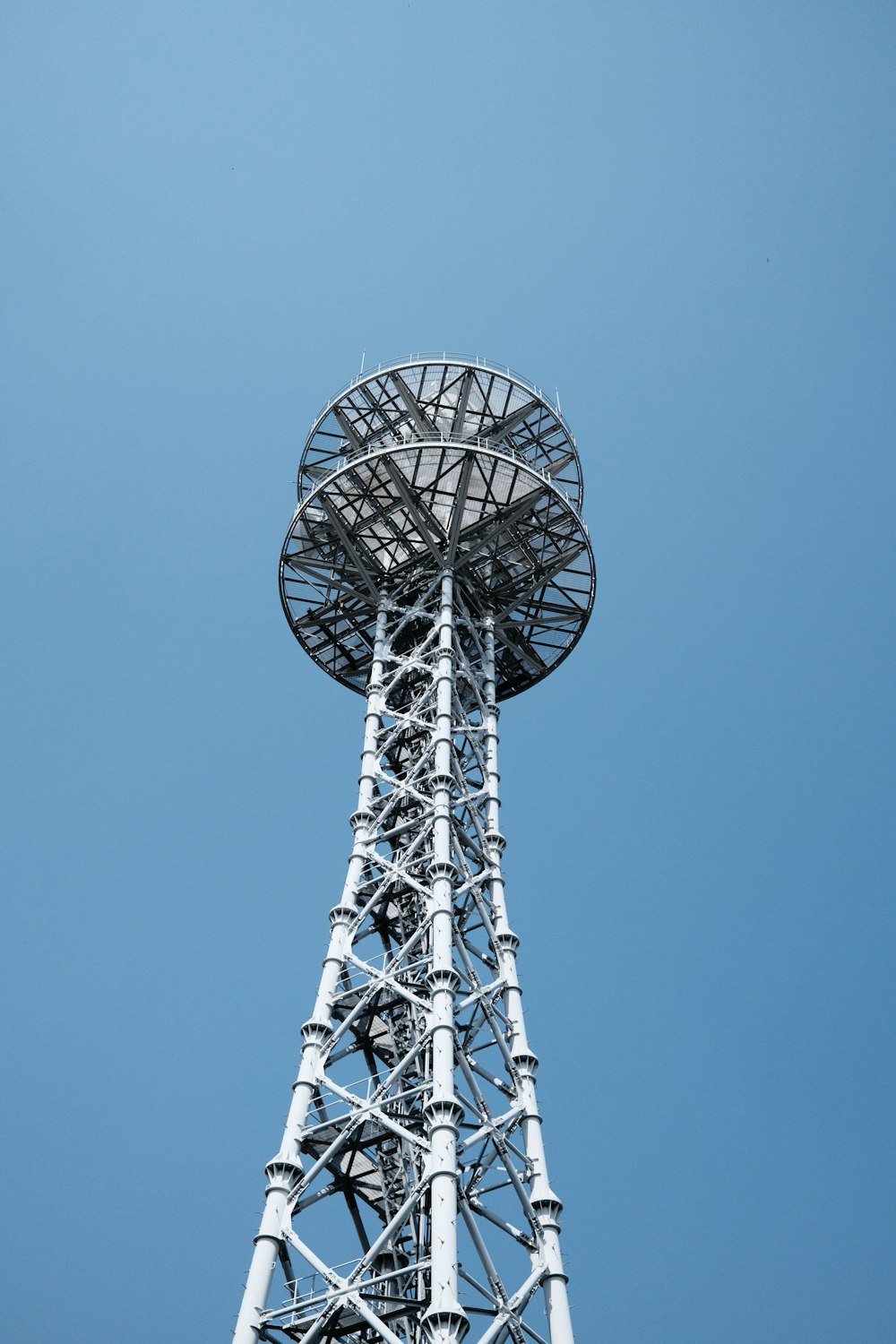 a very tall tower with a sky in the background