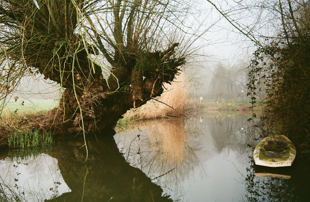 a small boat floating on top of a river