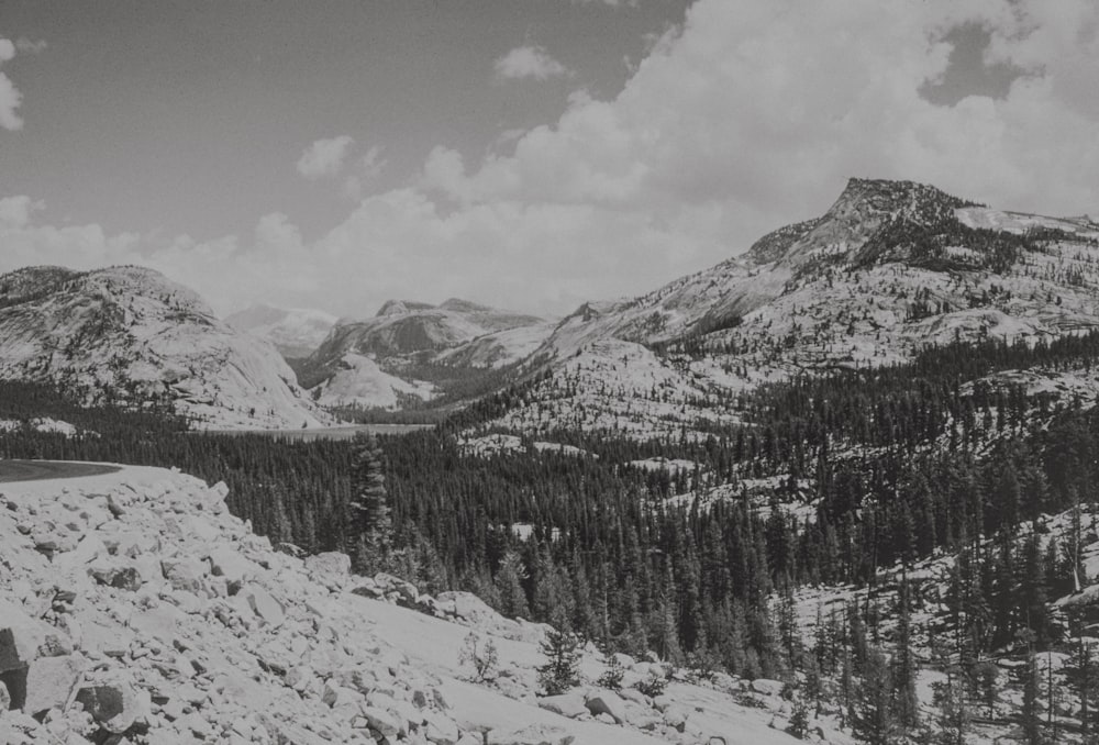 a black and white photo of snow covered mountains