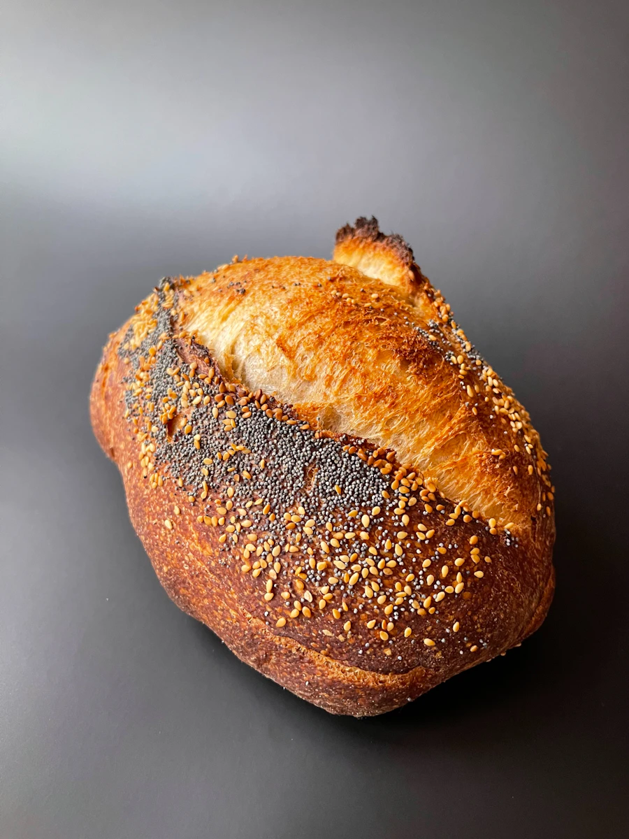 Seeded sourdough loaf with a blistered crust
